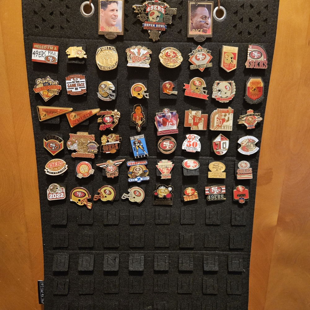 San Francisco 49ers Pin Lot Collection on Display Fabric Board.